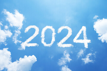 2024 cloud word floating on blue sky.