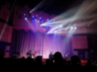 Fototapeta na wymiar Blurred of light effected from music concert stage in Big hall for music background, christian praise and worship concept, abstract art design.