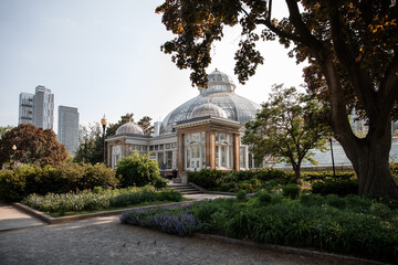 Fototapeta na wymiar Beautiful greenhouse in the park in summer