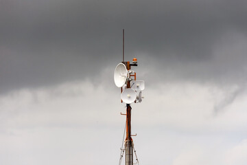 Wireless data station aerial view Against a cloudy sky. Cell tower