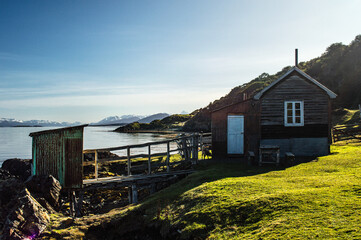 Country house on the coast of the Beagle Channel with the Andes mountain range in the background. Ushuaia, Estancia Tunel