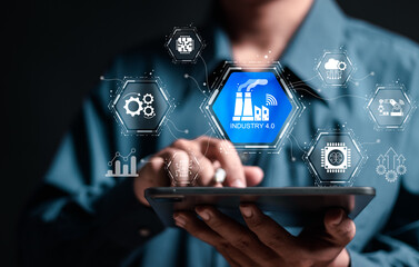 Smart industry 4.0 concept, Person use tablet with virtual screen of physical system, smart industrial revolution, automation, robot assistants, iot, cloud and big data.