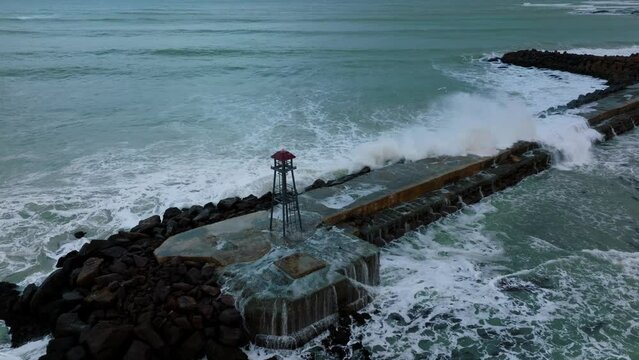 Aerial: Breakwater and beacon in Oamaru, Otago, New Zealand.