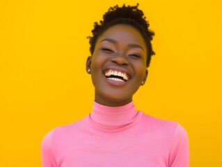 Vibrant image of a cheerful young African women laughing heartily, wearing a pink turtleneck against a vivid yellow backdrop.