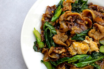 Stir-fried rice noodles with soy sauce and pork