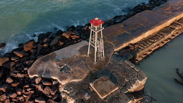 Aerial: Breakwater and beacon in Oamaru, Otago, New Zealand.