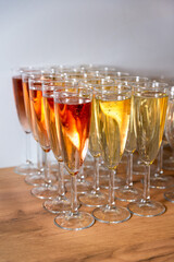 Sparkling Rose and White Wine in Flutes. Rows of sparkling rose and white wine served in elegant flutes, awaiting a toast at a celebratory event.