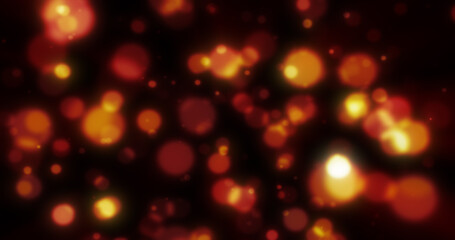 Abstract yellow blurred holiday background with magical bokeh of glowing bright light energy small particles of flying dots on a black background