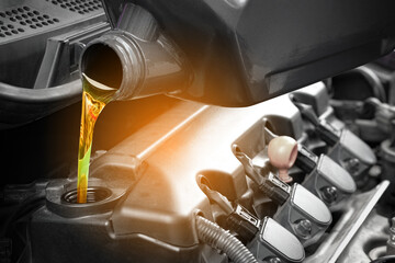 Refueling and pouring oil quality into the engine motor car Transmission and Maintenance Gear...