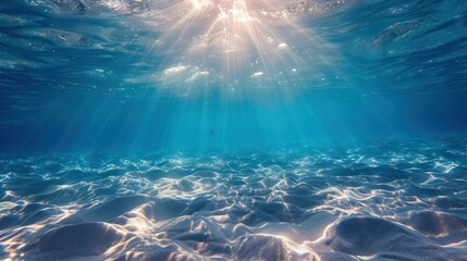 Fototapeta premium Underwater background with blue water and sun rays. Copy space.