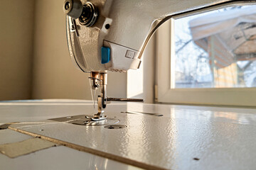 Modern sewing machine; close up of sewing needle and foot