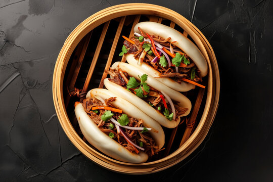 pulled beef bao buns, gua bao, in bamboo steam tray, top view
