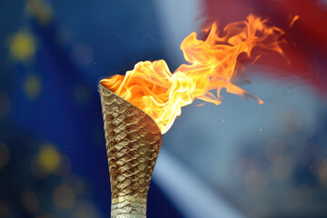 Flaming torch in front of the french flag - obrazy, fototapety, plakaty