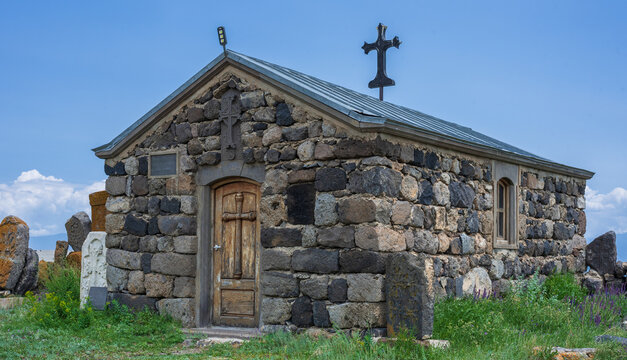 Artsvatrich Chapel on the shore of Lake Sevan, ancient khachkars with the image of a cross are Armenian shrines