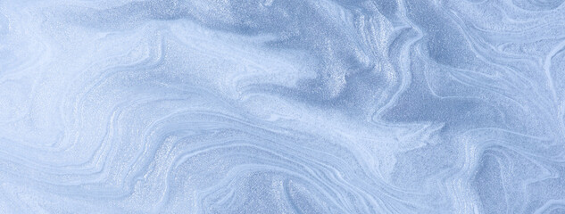 Abstract fluid art background light blue and silver colors. Liquid marble. Acrylic painting with denim shiny gradient.