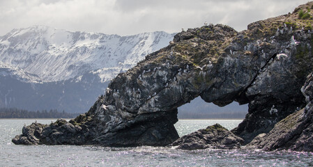 Rock arch near Gull Island in Kachemak Bay near Homer Spit in Alaska United States