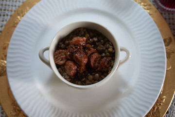 Hearty Italian dish featuring lentils and sausages, a flavorful medley that captures the essence of traditional Mediterranean cuisine.