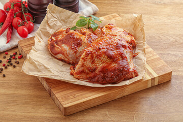Marinated chicken leg in tomato sauce