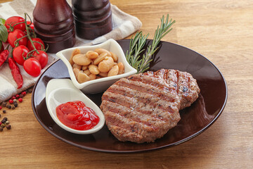 Grilled beef burger cutlet with sauce