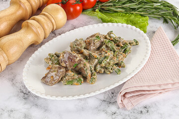 Fried turkey liver with herbs in cream sauce