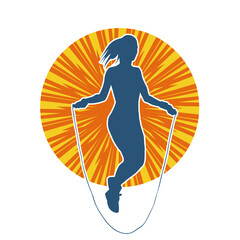 Silhouette of a slim sporty woman doing jump rope workout.