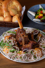 Kaurdak in Kazakh. lamb meat on a bone with potatoes, onions