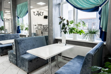 Interior of light colored canteen at the business center