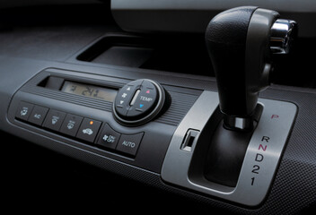 Automatic gear shift and air conditioning panel in a modern car. After some edits. 
