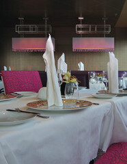 Elegant formal interior design with set tables style furniture, carpets and paneling onboard...