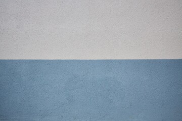 The texture of the structural rough surface of the plaster is gray and blue for use in design.