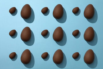 Delicious chocolate eggs on a blue background