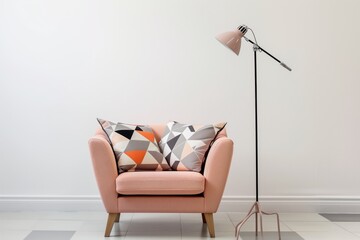 peach armchair with geometric cushions, floor lamp overhead in a minimalist room