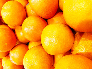 Healthy fruits, orange fruits background many orange fruits - orange fruit background in a supermarket super store