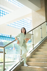 Portrait of young Asian businesswoman outside the office