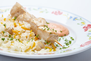 rice with chicken kebab and vegetables