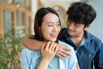 Photo of young Asian couple hang out together