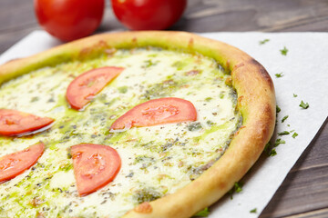 tasty pizza on the wooden background