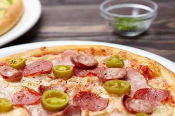 tasty pizza on the wooden background