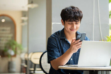 Photo of young Asian man at coffee shop