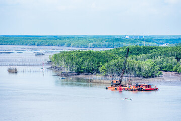 Obraz premium River bank panorama view near Ho Chi Minh city, Vietnam. 