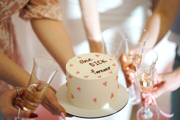 Cake for a hen party with the inscription "one dick forever"