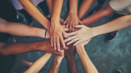 Diverse hands joining together symbolizing teamwork and diversity, family