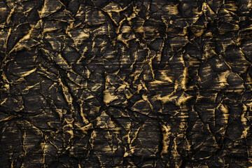 The Crumpled Black Paper Is Painted With Gold Paint