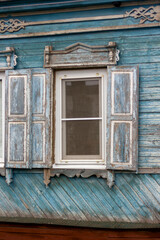 old wooden house with carved windows in the Russian village