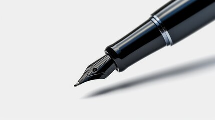 Fountain pen with a black nib resting on a white surface. Versatile image suitable for various...
