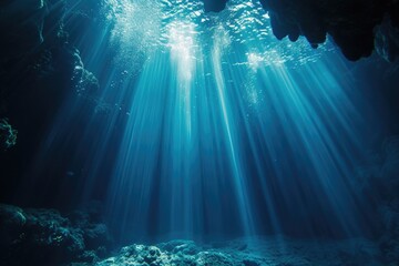 Sunlight shines through the water in a cave. Perfect for nature or underwater themes