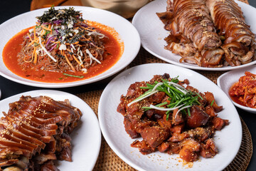 Jokbal, Korean food, steamed pork, tray, buckwheat noodles, side dishes, salted shrimp, lettuce, spicy, oriental medicine, flying fish roe, rice balls,