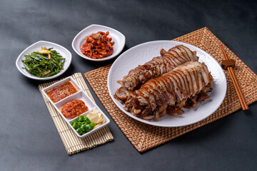 Jokbal, Korean food, steamed pork, tray, buckwheat noodles, side dishes, salted shrimp, lettuce, spicy, oriental medicine, flying fish roe, rice balls,
