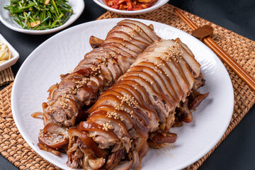 Jokbal, Korean food, steamed pork, tray, buckwheat noodles, side dishes, salted shrimp, lettuce, spicy, oriental medicine, flying fish roe, rice balls,