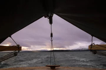 Fototapeten sailing trip in Norway with dramatic clouds © johannes81